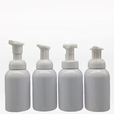 China Good Quality Cosmetic Round Foaming Soap Pump Bottles Glass Round Lotion Pumps Cosmetic Bottles for sale