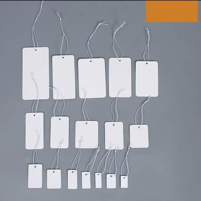 China Recyled Custom Free Design Printing Name Logo Brand Tags Kraft Paper Tags Clothing Hang Tags With White Black String for sale