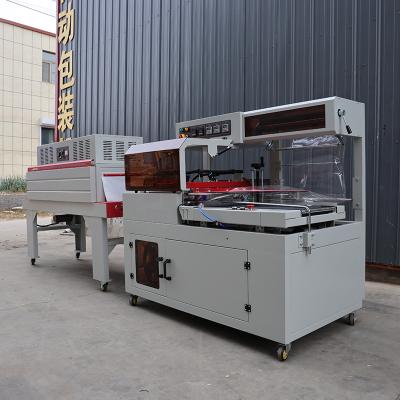 Cina Macchina di avvolgimento a calore industriale a forma di L Avvolgimento a calore per alimenti e bevande personalizzabile in vendita