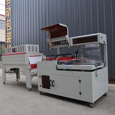 Cina 1.35KW Box Shrink Wrap Machine 220V / 380V Shrink Wrapper per alimenti e bevande in vendita
