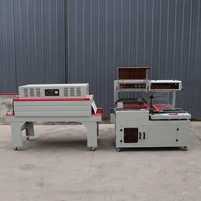 Cina Compact L Shape Shrink Wrap Packaging Machine Voltaggio 380V 440V in vendita