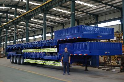 Cina 4 axle 80 tons to 100 tons heavy machine loading low loader trailer for sale in vendita