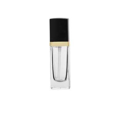 China High Qiality 30ml Base Glass Bottle With Transparent Pump Color Bottle With Gold Pump for sale