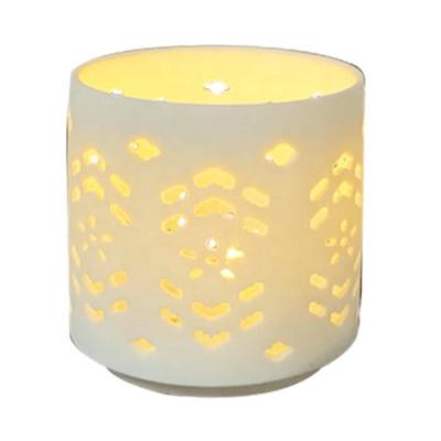 China Special sale cheap hot quality white ceramic candle holder hollowed out for home decor for sale