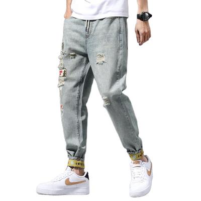 China Men's Breathable Pencil Pants Stylish Fashion Ripped Jeans Europe American Style Ragged Hot Ripped Jeans for sale