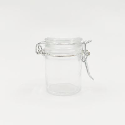 China Freshness Retention Airtight Clear Glass Mini Jar 50ml Round Spice Jar With Flip Top Trim for sale