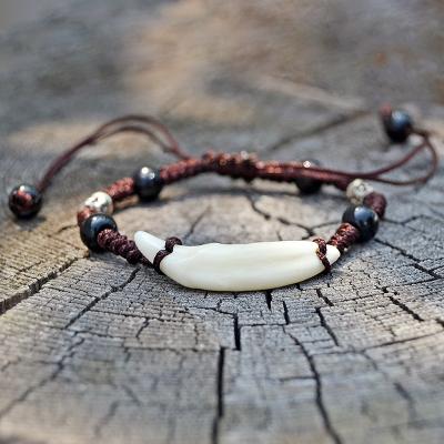 China Natural Vintage Faux Wolf Tooth Hand Rope Bracelet Men Tibet Amulet Fang Bracelet Women Primitive Tribes Bone Jewelry Bracelet YS001 for sale