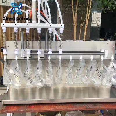 China Automatic Magnetic Stand Up Spout Pump Water Oil Yogurt Pouch Filling Packing Machine à venda