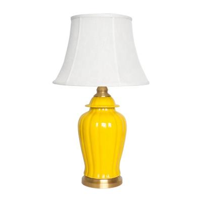 China Modern Chinese yellow temple pot ceramic table lamp with fabric shade hotel bedside table lamps decoration for sale