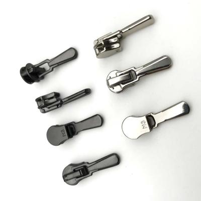 China The other factory provides the low cost accessories, metal garment zipper sliders with zipper accessories slider for sale
