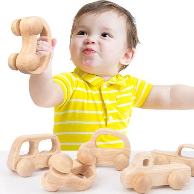 China Eco-friendly Material Wooden Infant Carriage Baby Grab Carriage Exciting 0-3 Years Old Children's Teeth Toy Gift Inertia Carriage for sale