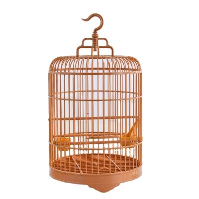 China Sustainable Plastic Round Hanging Bird Cage With Feeder for sale