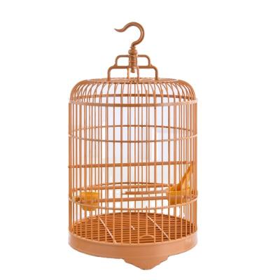 China Sustainable Plastic Round Hanging Bird Cage With Feeder for sale