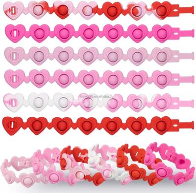 China Valentine's Day Heart Shape Push Bubble Toy Fidget Sensory Stress Reliever Silicone The Restless Heart Bracelet Durable for sale