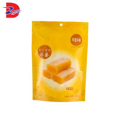 China Security factory price pressure multi-light double-sided aluminum foil sealing gold colored stand up packaging bag for sale
