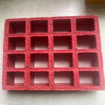 China Mesh size 38x38mm, FRP molded grating of red color., anti-slippery surface with grit on the surface. Very good performance for carwash and other job location for sale