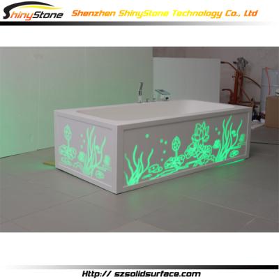 China Frameless CNC carving design ligting hand working solid outdoor free standing white resin bathub for sale