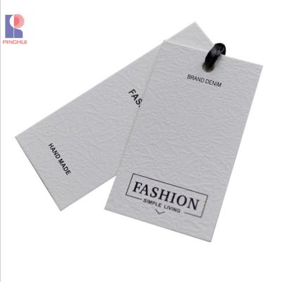 China Custom Luxury Recyled Swing Tag Printing Paper Clothing Labels Tags for sale