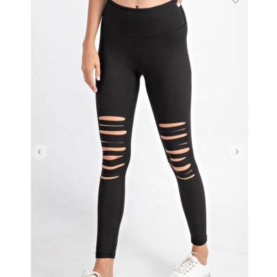 China Wholesale Fashion Breathable Soft Ripped Distressed Sport Pants Waist Wide Black Laser Cut Yoga Leggings for sale