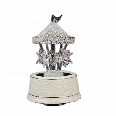 China Factory Wholesale Creative Turned Glass Carousel Gift Happy-go-around Horse Carousel Music Box with RGB LED Light Changing Resin Base for sale