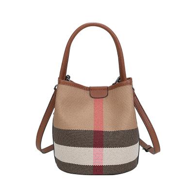 China Others 2023 new high-level sense of leather round bucket bag sub mother fashion hundreds of handheld single shoulder crossbody bag for sale