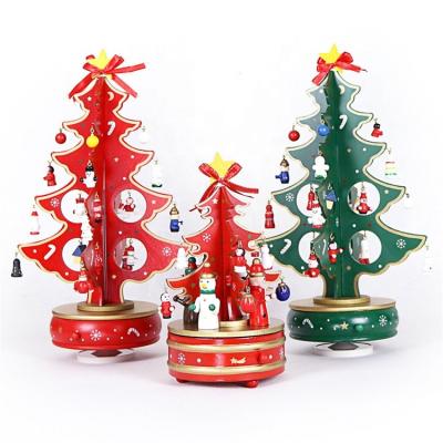 China Eco-friendly Christmas Decorations Snow tTree Gifts Snowman Music Box Wooden Rotating Ornament for sale