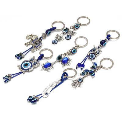 China Glass Elephant Turtle Evil Eye Turkey Car Key Chain Animal Key Chain Pendant for sale