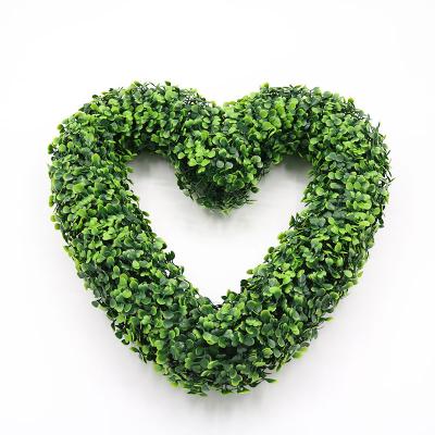 China Home Garden Office Wedding Decoration UV Resistant Wedding Decoration Plastic Hanging Greenery Leaves Heart Shaped Garland Artificial Wreath for sale