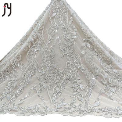 China 2022 Viable New Arrival High Quality Nigerian White Bridal Lace Fabric 3-5mm Sequin Net Silver Beaded Embroidery Lace Fabric for sale