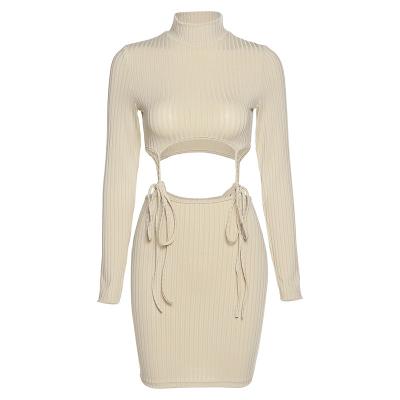 China 2022 Breathable Women Bandage Sling Dress Long Sleeve Hollow Ribbed Elastic Bodycon Sweater Dress Turtle Neck Fashion Casual Outfits for sale