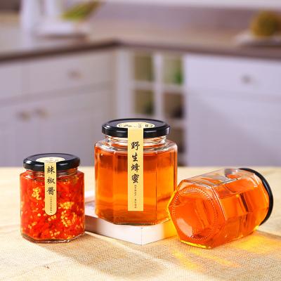 China Honey/Jam Packaging Manufacturer Customized Size Transparent Glass Honey Jar Jam Bottle With Lid Chinese Hexagon Honey Container In Stock for sale