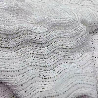 China Viable wholesale polyester with spandex knitted lace fabric material eyelet lace knitting fabric for sale