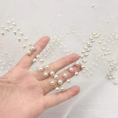 China Breathable NO MOQ 100%nylon border design Tulle bead fabric beaded lace tulle mesh fabric for sale
