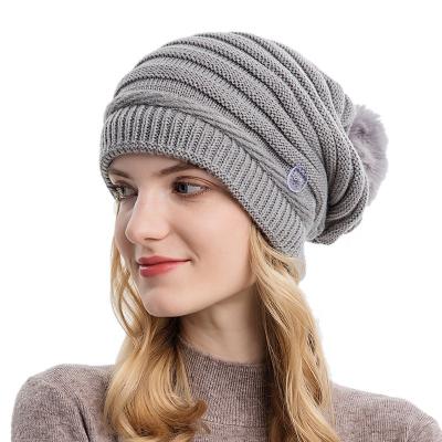 China COMMON Fashion Style Wool Knitted Rib Slouchy Warm Beanie Hat for Women with Soft Pom Pom Winter Cap Pure Color Beanie Hat for sale