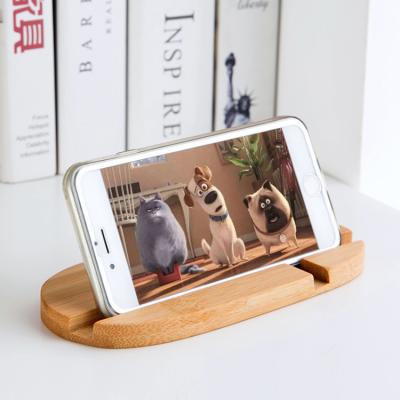 China Custom Logo Bamboo Mobile Phone Holders Mobile Phone Bracket Waterproof Lazy Bottom Accessories Desktop Stand for sale