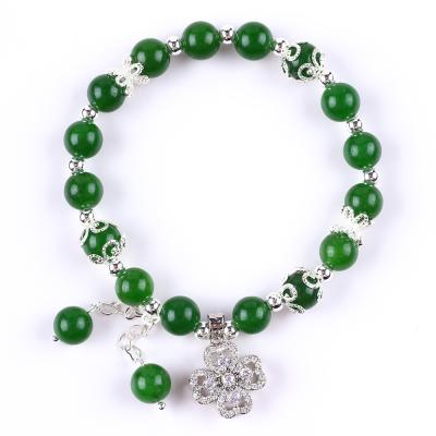China 8MM Piedra de Jade Verde Oscuro con Flor de Spinner Encanto de curación espiritual Forma redonda Brazalete de cuentas de estiramiento en venta