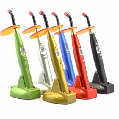 China Caneta de cura dental sem fio Design de arco-íris colorido LED 10S Luz de cura dental de plástico à venda