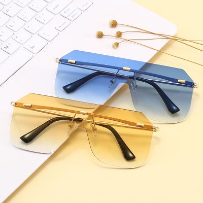 China Fashion sunglasses 11639 2021 fashion one piece tinted lens women sunglasses ladies UV400 rimless sunglasses for sale