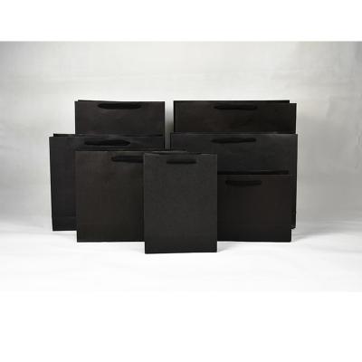 China Customizable Luxury Shopping Paper Bag Black Shopping Bag With Handle for sale