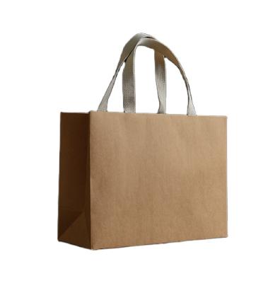 China Recycled Materials Logo Custom Paper Kraft Paper Shopping Packaging Bag With Handle for sale