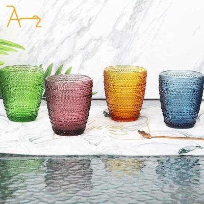 China Sustainable Wholesale Custom Embossed Vintage Beverage Glass Cup Wedding Decorative Colored Glassware Drinking Water Glass Cups for sale