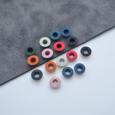 China Nickel Free Custom Logo Round Metal Eyelets Flat Garment Accessories Eyelets for sale