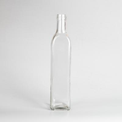 China Food factory price square essential oil bottle clear glass vinegar bottle olive oil glass bottle1209 for sale