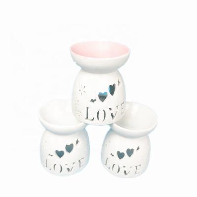 China Fashionable Decoration Porcelain Tea Light Holder Ceramic Essential Oil Burner for sale