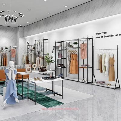 China Custom one-stop design stainless steel fabric shop display rack women clothes display racks metal retail boutique gold clothing rack for sale
