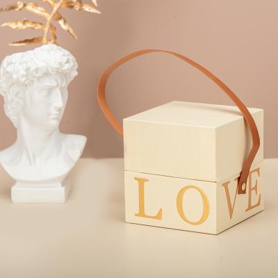 China Recycled Materials Cream Textured Paper Gift Box With Rigid Handle Shoulder Boxes Box With Lid For Necklaces Bracelets Rings And Earrings for sale