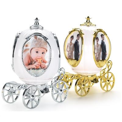 China Custom Pumpkin Carriage 360 Sides Rotating 4 Plastic Photo Frame Music Box For Home Decor for sale