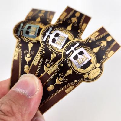 China Banda de etiqueta de papel de lujo Impresión de cigarros de papel de oro Etiqueta de cigarrillo de banda Etiqueta de cigarrillo Etiqueta de estampado de oro en relieve en venta
