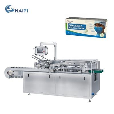 China Full Automatic Operation Easy Packing Face Mask Carton Box Sealing Cartoning Machine for sale