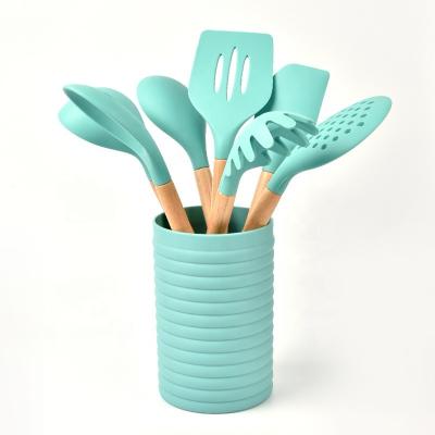 China Sustainable Wholesale 7pcs Kitchen Utensils Set Heat Resistant Silicone Cookware Sets With Wooden Handle for sale